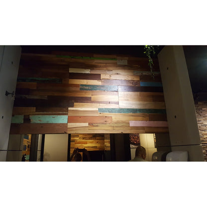 Wooden wall with multicolored planks in a room setting